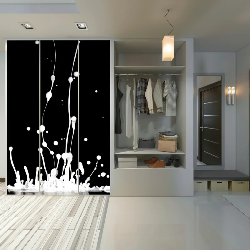 Schrankaufkleber weiße flüssigkeitsspritzer auf schwarzem hintergrund