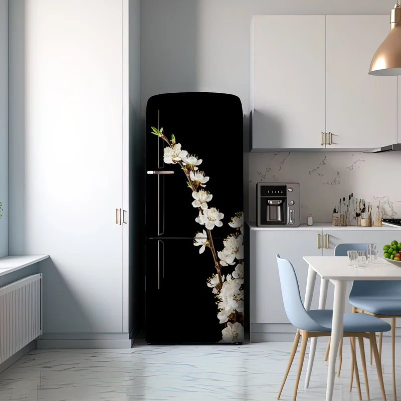 Kühlschrankaufkleber zarter zweig mit aprikosenblüten auf schwarzem hintergrund