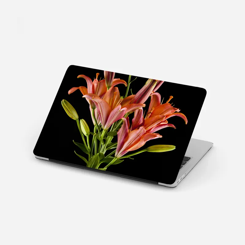 Laptop-Aufkleber leuchtende rosa lilien vor schwarzem hintergrund