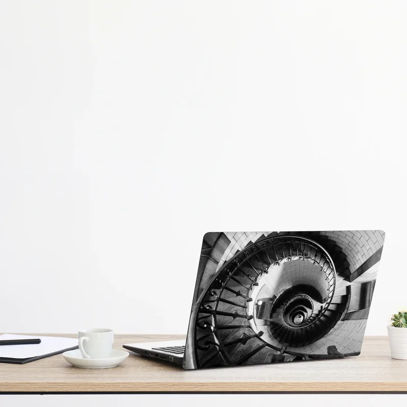 Naklejka na laptopa spiralne schody w monochromatycznej perspektywie