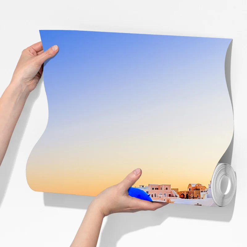 Fototapete Santorini sonnenuntergang über blauen kuppeln Fototapete Santorini sonnenuntergang über blauen kuppeln