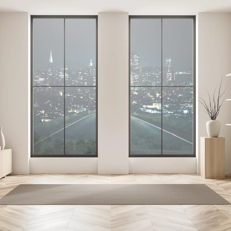 Fensteraufkleber straße zur beleuchteten stadtsilhouette bei nacht