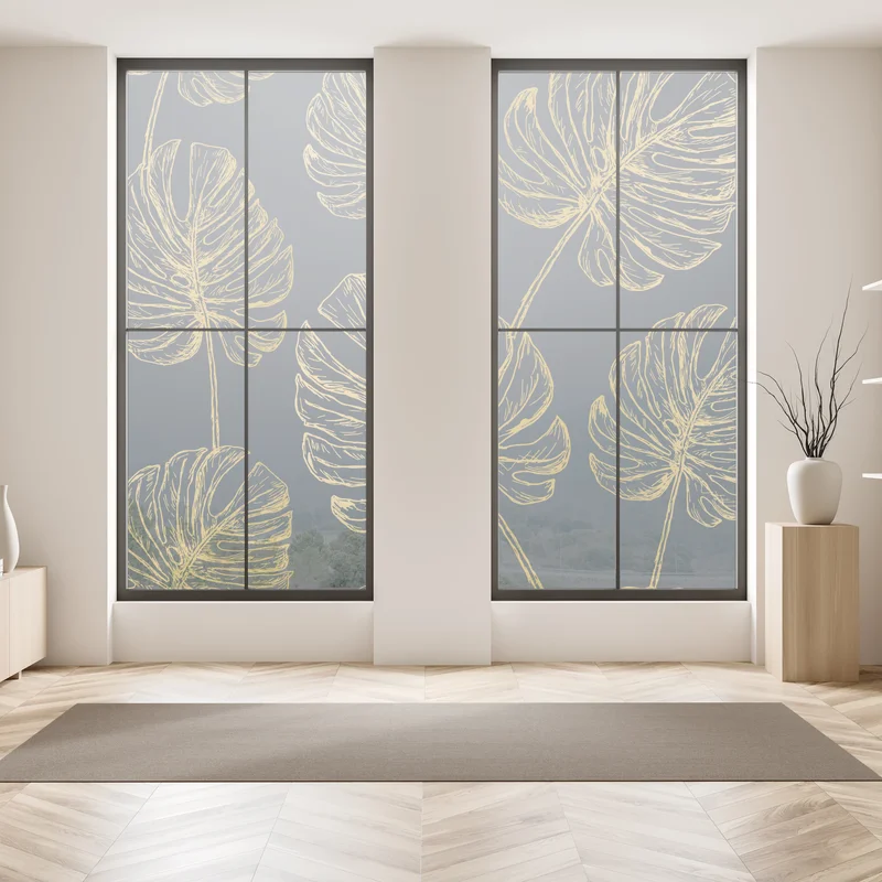 Fensteraufkleber goldene monstera-blätter auf dunklem hintergrund