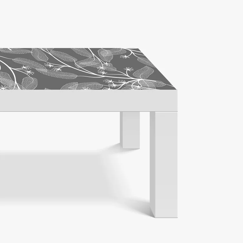 Tischaufkleber und Schreibtischaufkleber zarte weiße blätter auf grauem hintergrund