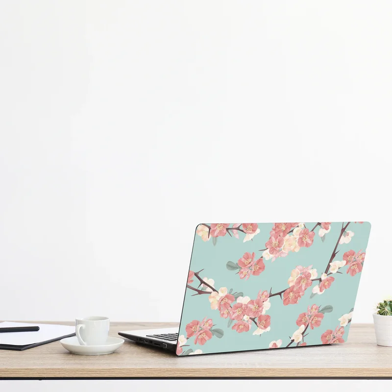 Laptop-Aufkleber pastelliges kirschblütenmuster auf mintfarbenem hintergrund Laptop-Aufkleber pastelliges kirschblütenmuster auf mintfarbenem hintergrund