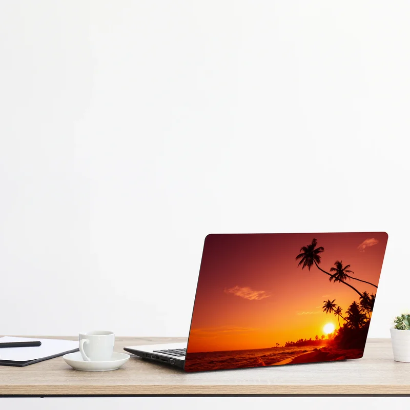 Naklejka na laptopa tropikalny zachód słońca nad plażą