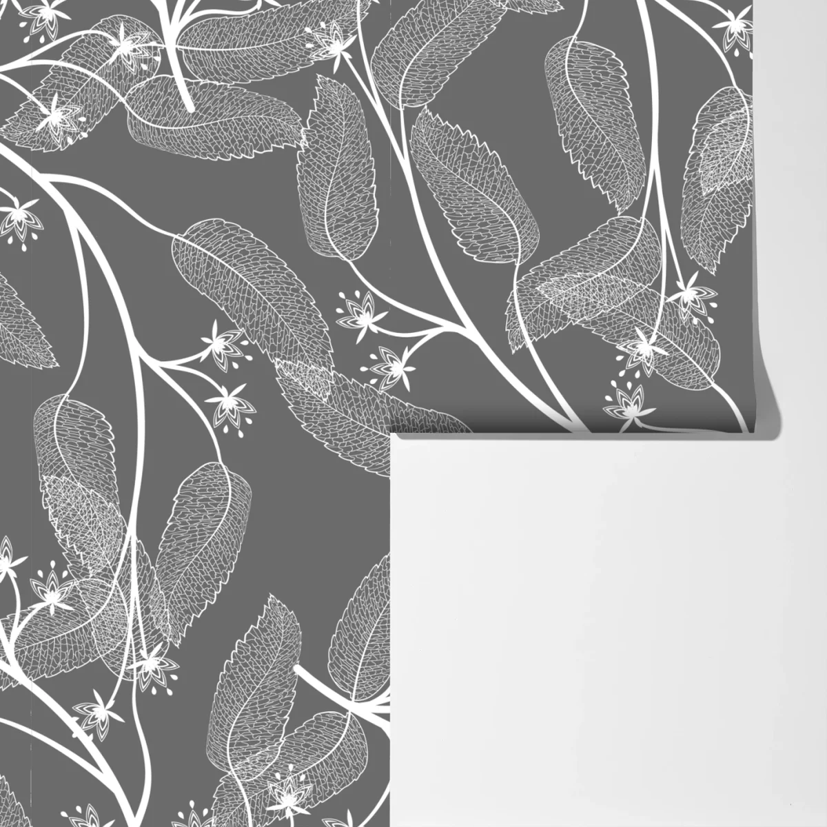 Fototapeta delikatne białe liście na szarym tle Fototapeta delikatne białe liście na szarym tle