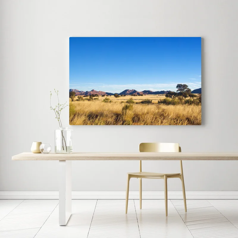 Leinwandbild ruhige savannenlandschaft unter klarem blauem himmel Leinwandbild ruhige savannenlandschaft unter klarem blauem himmel