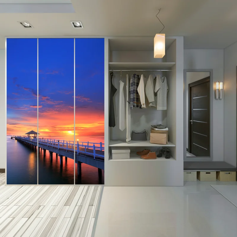 Schrankaufkleber mole bei sonnenuntergang am strand