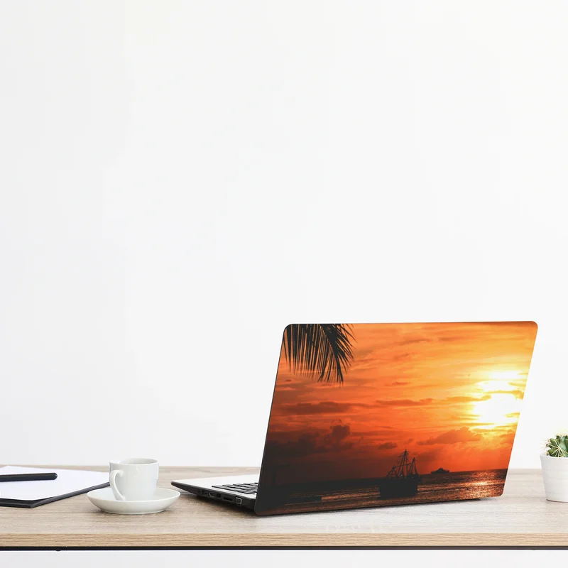 Naklejka na laptopa tropikalny zachód słońca nad morzem