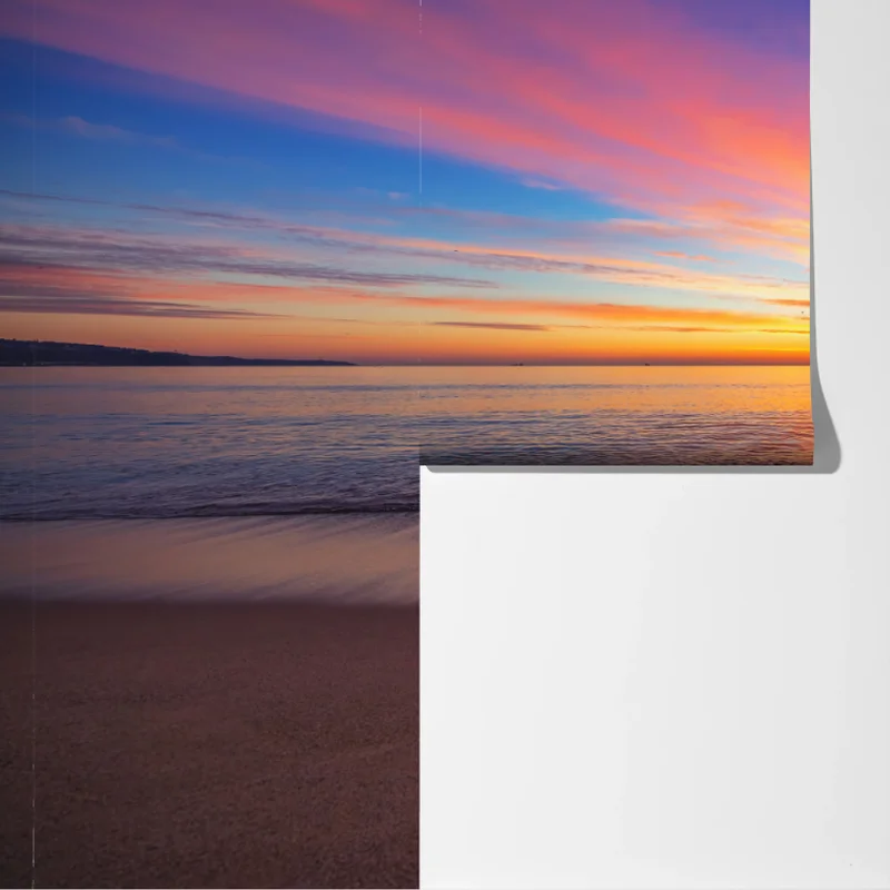 Fototapeta żywy wschód słońca nad spokojną plażą Fototapeta żywy wschód słońca nad spokojną plażą