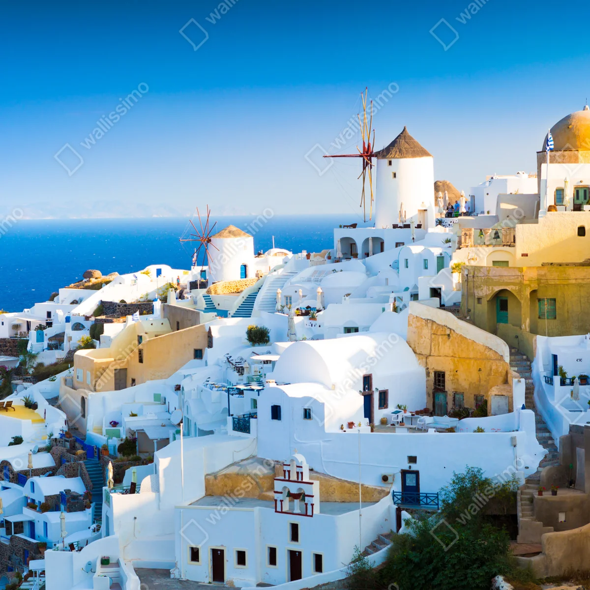 Leinwandbild sonnenbeschienenes Santorini-dorf am meer Leinwandbild sonnenbeschienenes Santorini-dorf am meer