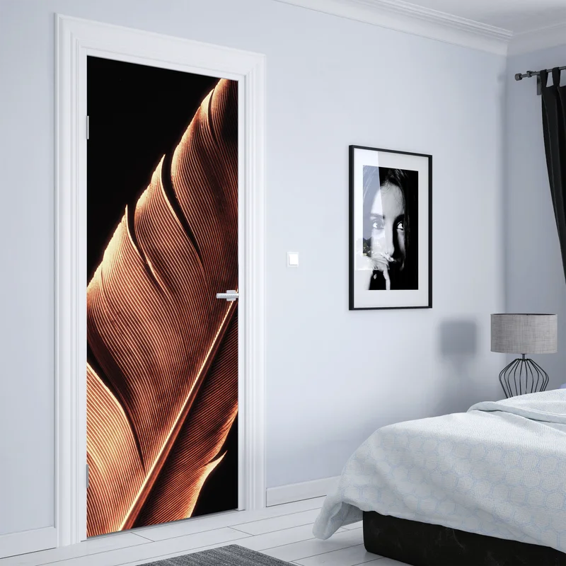 Türaufkleber goldene feder makro vor schwarzem hintergrund