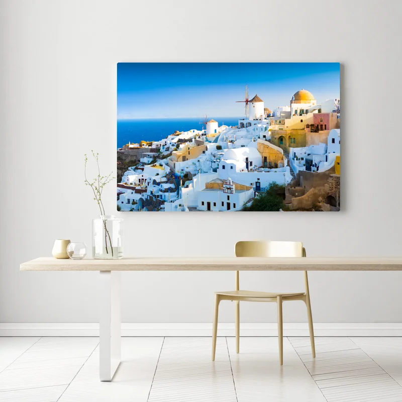 Leinwandbild sonnenbeschienenes Santorini-dorf am meer Leinwandbild sonnenbeschienenes Santorini-dorf am meer