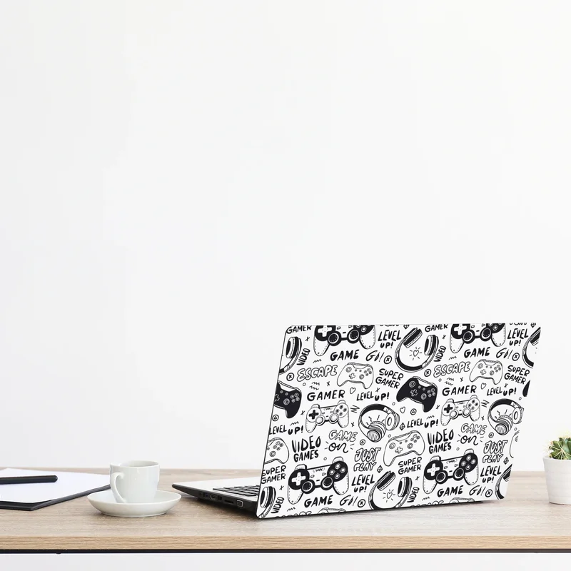 Laptop-Aufkleber doodle-muster mit videospiel-controllern Laptop-Aufkleber doodle-muster mit videospiel-controllern