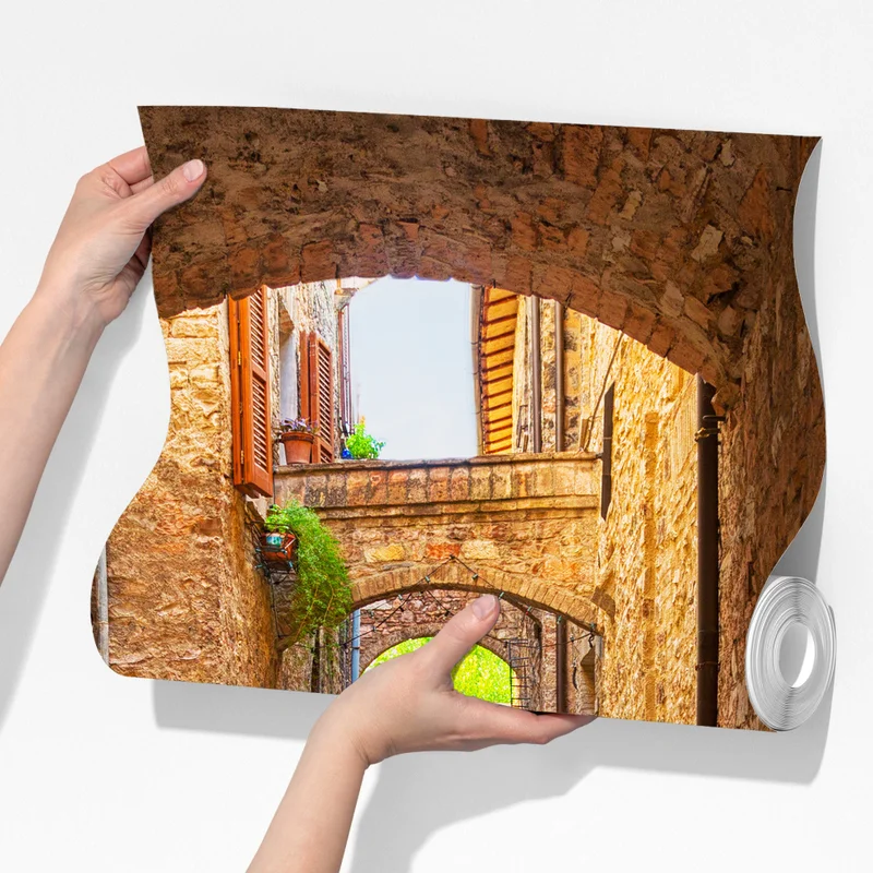 Fototapeta słoneczna uliczka z doniczkami w Spello Fototapeta słoneczna uliczka z doniczkami w Spello