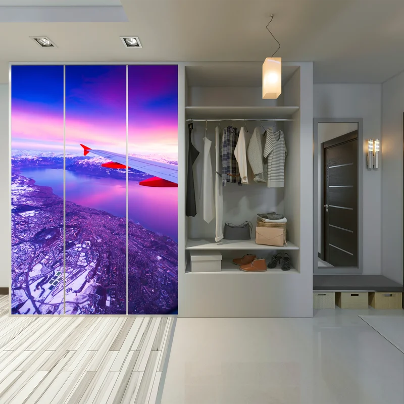 Schrankaufkleber luftaufnahme einer stadt am see bei sonnenuntergang