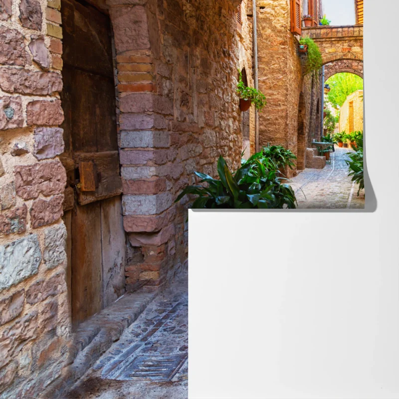 Fototapete sonnige gasse mit blumentöpfen in Spello Fototapete sonnige gasse mit blumentöpfen in Spello