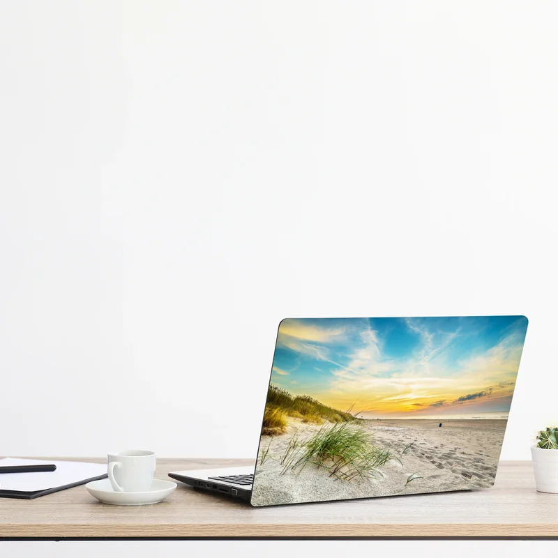 Naklejka na laptopa zachód słońca nad spokojnymi wydmami