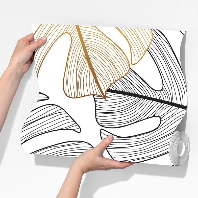 Fototapete monstera-blattmuster mit goldakzenten Fototapete monstera-blattmuster mit goldakzenten