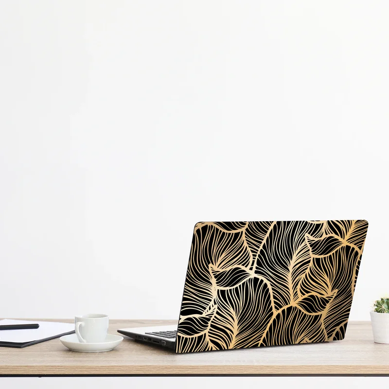 Naklejka na laptopa złoty wzór liści na czarnym tle