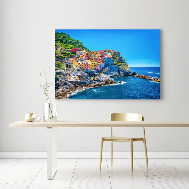 Leinwandbild farbenfrohes dorf am klippenmeer Leinwandbild farbenfrohes dorf am klippenmeer