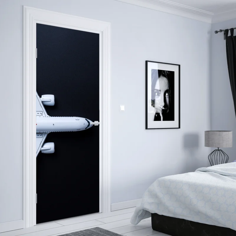 Türaufkleber weißes flugzeug von oben auf schwarzem hintergrund Türaufkleber weißes flugzeug von oben auf schwarzem hintergrund