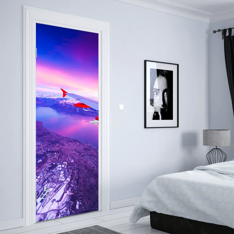 Türaufkleber luftaufnahme einer stadt am see bei sonnenuntergang