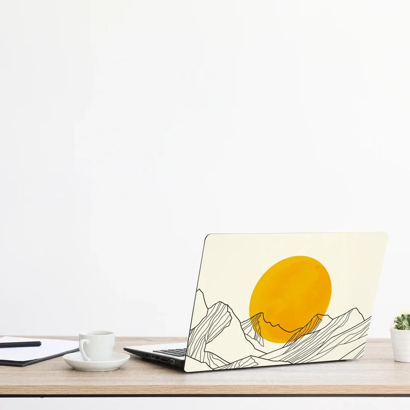 Naklejka na laptopa złote słońce nad minimalistycznymi górami