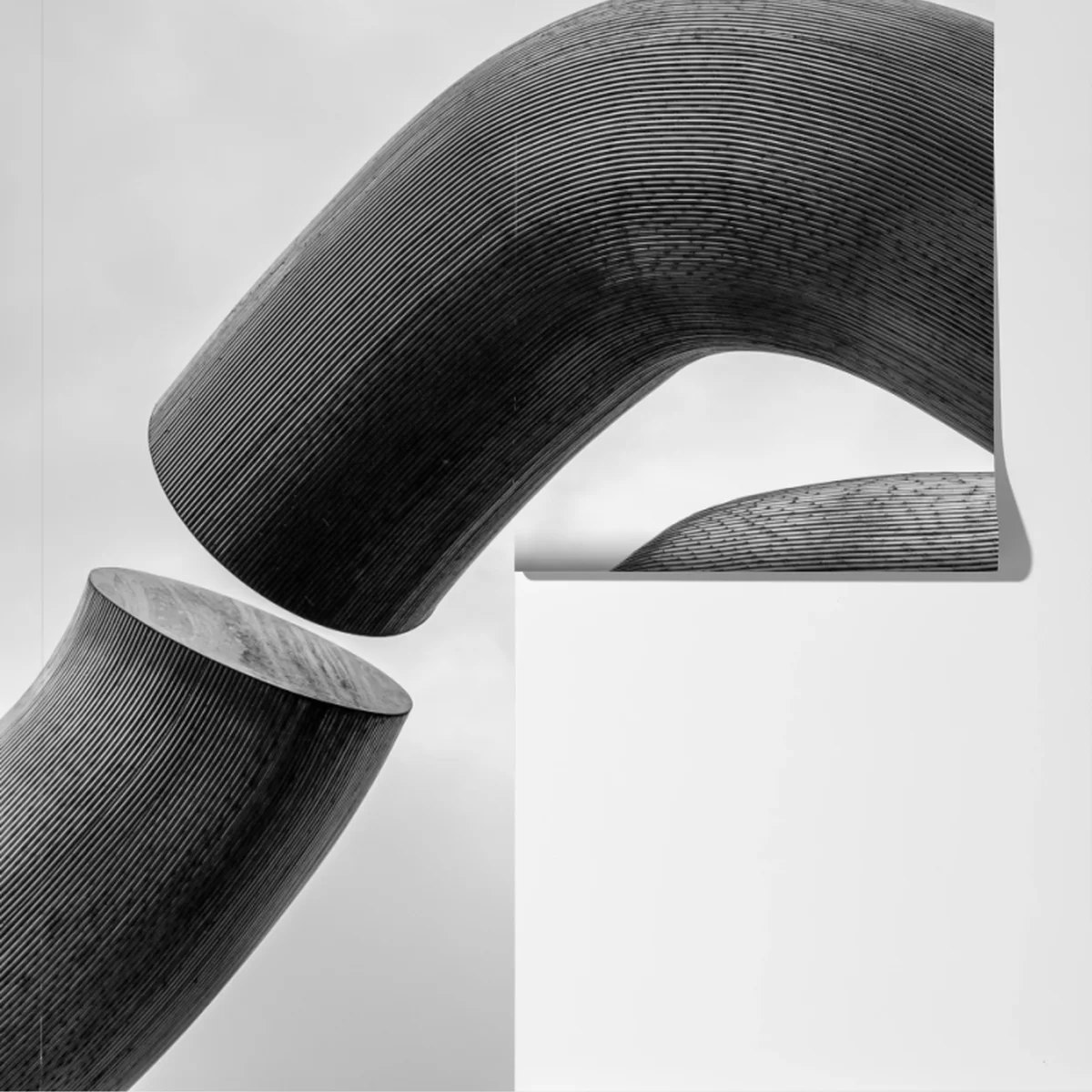 Fototapete gekrümmte formen abstrakte skulptur in grau Fototapete gekrümmte formen abstrakte skulptur in grau