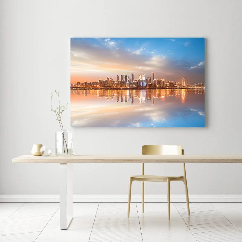 Leinwandbild stadtsilhouette im spiegelbild bei dämmerung Leinwandbild stadtsilhouette im spiegelbild bei dämmerung