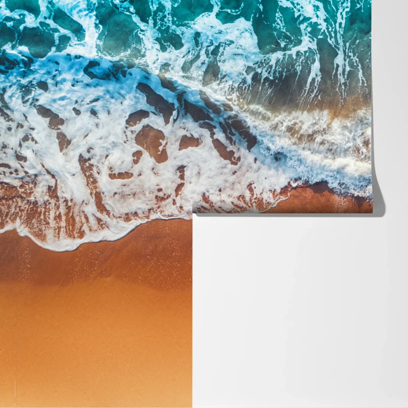 Fototapete luftaufnahme türkisfarbener wellen an einem sandstrand Fototapete luftaufnahme türkisfarbener wellen an einem sandstrand