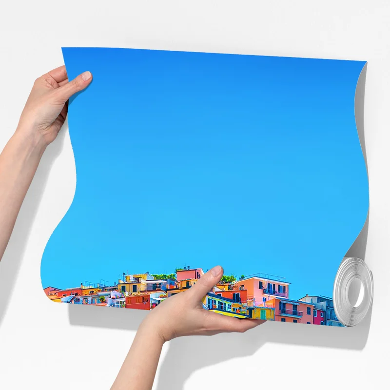 Fototapete farbenfrohes dorf am klippenmeer Fototapete farbenfrohes dorf am klippenmeer