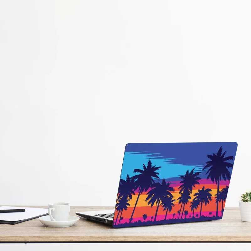 Naklejka na laptopa żywy zachód słońca z palmami