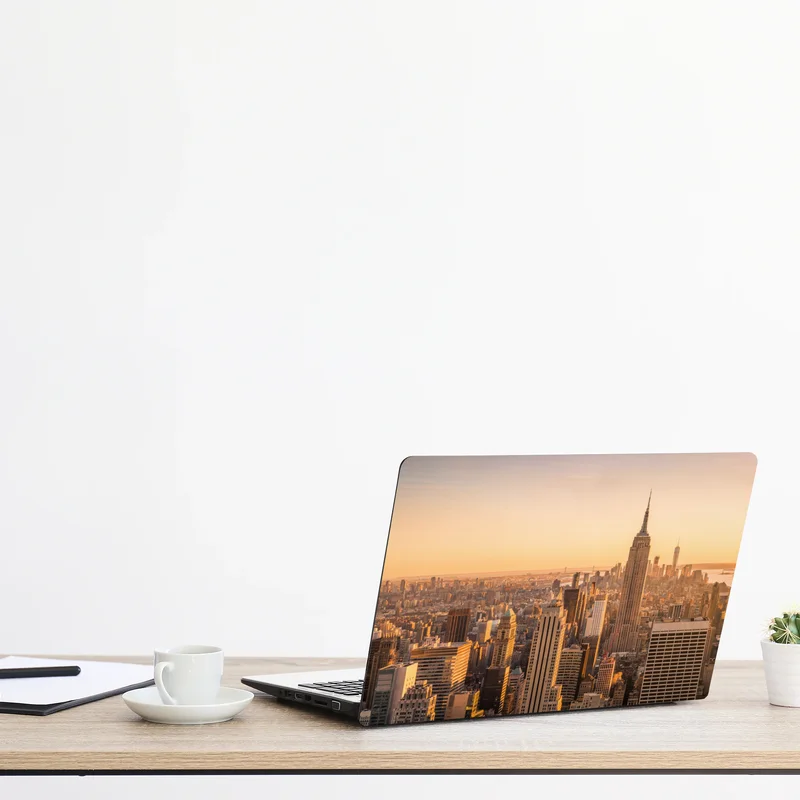 Naklejka na laptopa złoty zachód nad panoramą Nowego Jorku