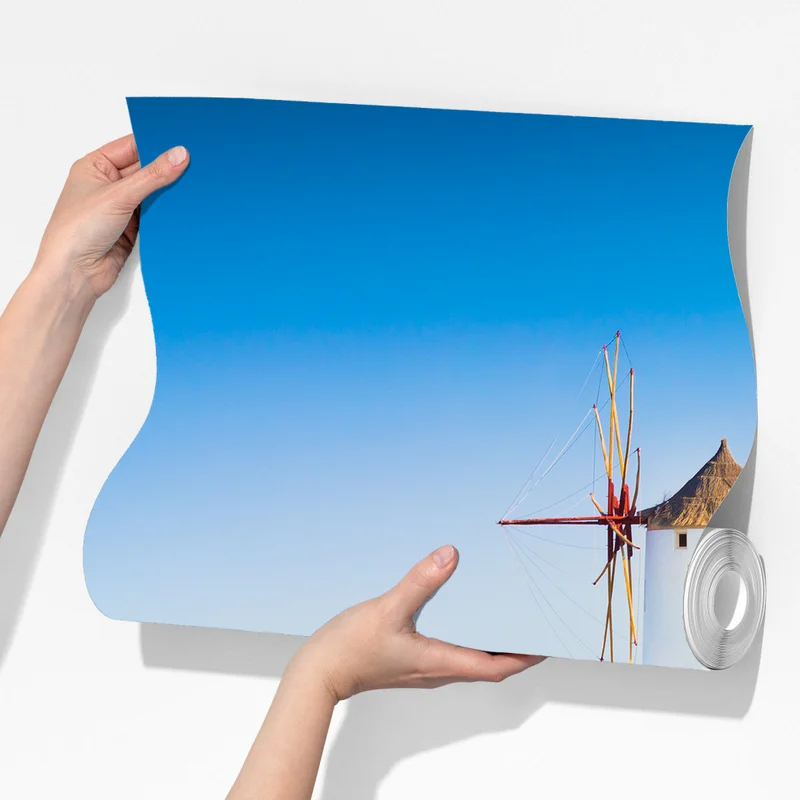 Fototapete sonnenbeschienenes Santorini-dorf am meer Fototapete sonnenbeschienenes Santorini-dorf am meer