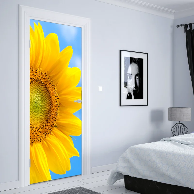 Türaufkleber leuchtende sonnenblume vor blauem himmel