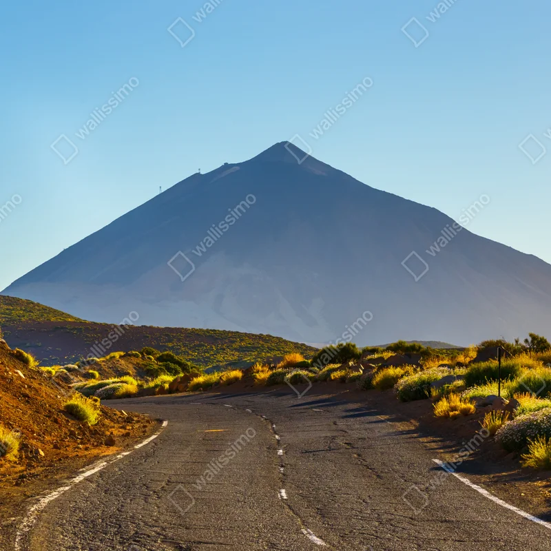 Fototapete sonnenbeschienene bergstraße zum vulkan Fototapete sonnenbeschienene bergstraße zum vulkan