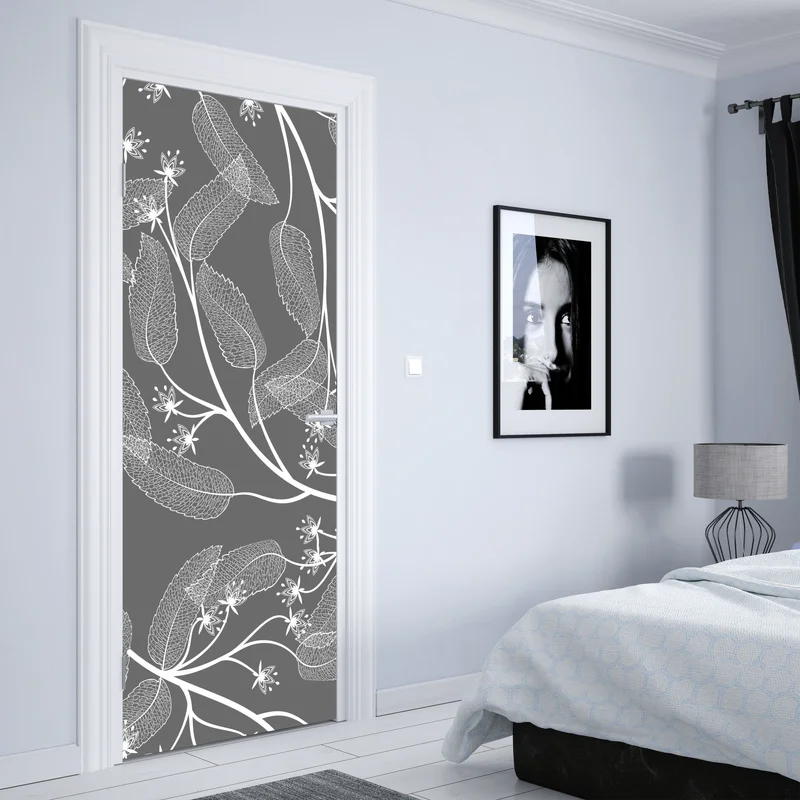 Türaufkleber zarte weiße blätter auf grauem hintergrund Türaufkleber zarte weiße blätter auf grauem hintergrund