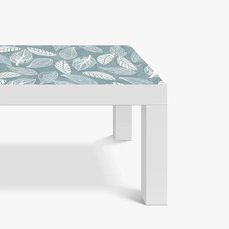 Tischaufkleber und Schreibtischaufkleber handgezeichnetes blättermuster auf türkisfarbenem hintergrund